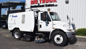 Shiny rims on a street sweeper Truck